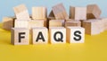 Faqs word construction with letter blocks and a shallow depth of field