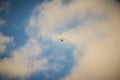 Far away of flying drone on cloudy blue sky and maybe it will out of control. Professional camera drone flying in blue sky and Royalty Free Stock Photo