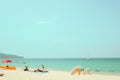 Far away image shot and blurred face of crowd people on sand beach