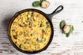 Far away shot of baked egg frittata and spinach Royalty Free Stock Photo