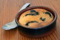 Far Breton in a ramekin with a spoon close-up Royalty Free Stock Photo