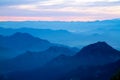 Far mountains with blue haze and clouds Royalty Free Stock Photo