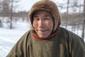 Far north of Yamal, tundra, pasture nord reindeers, closeup portrait of Nenets at age, close-up portrait of Nenets in national