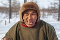 Far north of Yamal, tundra, pasture nord reindeers, closeup portrait of Nenets at age, close-up portrait of Nenets in national