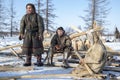 Far north of Yamal, tundra, pasture nord reindeers, family of reindeer herders of the north, father with two sons and a dog