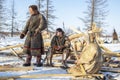 Far north of Yamal, tundra, pasture nord reindeers, family of reindeer herders of the north, father with two sons and a dog