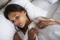 Far off in dream land. A beautiful young woman sleeping in her bed. Royalty Free Stock Photo