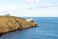 Far view of the Baily Lighthouse at Howth Head in Dublin, Ireland Royalty Free Stock Photo