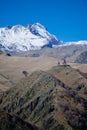 Far view of Gergeti Holly Trinity Church in Georgia near mount Kazbek Royalty Free Stock Photo