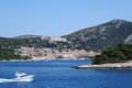 A faraway view from the ferry of the town of Hvar, on Hvar Island, Croatia. It is a beautiful sunny summer day