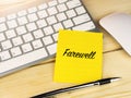 Farewell on sticky note on work desk Royalty Free Stock Photo