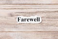 Farewell of the word on paper. concept. Words of Farewell on a wooden background