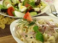 Farfalle pasta with ham on a plate Royalty Free Stock Photo