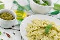 Farfalle pasta with pesto genovese basil sauce on white rusti Royalty Free Stock Photo