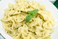 Farfalle pasta with pesto genovese & x28;basil sauce& x29; on rustic wood Royalty Free Stock Photo