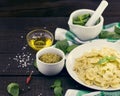 Farfalle pasta with pesto genovese & x28;basil sauce& x29; on rustic wood Royalty Free Stock Photo