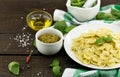 Farfalle pasta with pesto genovese & x28;basil sauce& x29; on rustic wood Royalty Free Stock Photo