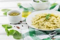 Farfalle pasta with pesto genovese & x28;basil sauce& x29; on white rusti