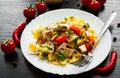 Farfalle pasta salad with chicken and vegetables in plate Royalty Free Stock Photo