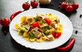 Farfalle pasta salad with chicken and vegetables in plate Royalty Free Stock Photo