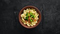 Farfalle pasta with vegetables on the plate. Royalty Free Stock Photo