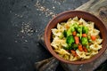Farfalle pasta with vegetables on the plate. Royalty Free Stock Photo