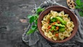 Farfalle pasta with vegetables on the plate. Royalty Free Stock Photo