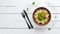 Farfalle pasta with vegetables on the plate. Royalty Free Stock Photo