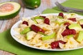 Farfalle Pasta warm salad with avocado slices and smoked sausage Royalty Free Stock Photo