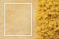 Farfalle macaroni Beautiful laid out pasta with the right, side view on a wooden table top with a textured background. Close-up vi