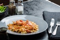 Farfalle with tomato sauce and roasted salmon Royalty Free Stock Photo