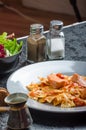 Farfalle with tomato sauce and roasted salmon Royalty Free Stock Photo