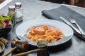 Farfalle with tomato sauce and roasted salmon Royalty Free Stock Photo