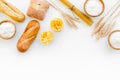 Farinaceous food. Fresh bread and raw pasta near flour in bowl and wheat ears on white background top view space for