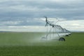 An farm agriculture irrigation water sprinkler at a farm. Royalty Free Stock Photo