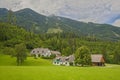 A farm in the alpine countryside in the middle of mountains, Austria Royalty Free Stock Photo