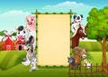 Farm animals with a blank sign bamboo Royalty Free Stock Photo
