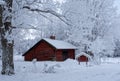 Farm barn surrounded by frosty trees Royalty Free Stock Photo