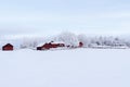 Farm barn and house surrounded by frosty trees Royalty Free Stock Photo