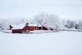 Farm barn and house surrounded by frosty trees Royalty Free Stock Photo