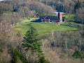 Farm, Barn, Silo surrounded by forest Royalty Free Stock Photo