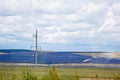 A farm of batteries of solar power plants on a field under a sky full of clouds. green electricity. alternative energy Royalty Free Stock Photo