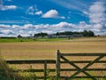 Farm buildings across a rural landscape of arable fields in Northumberland, England, UK Royalty Free Stock Photo