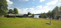 Farm buildings an meadow in cultural reserve area Gallejaur in Norrbotten, Sweden Royalty Free Stock Photo