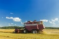 Farm combine harvester with elevator to upload cereal into trailer Royalty Free Stock Photo