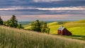 Farm crops lead to a beautiful red barn Royalty Free Stock Photo