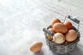 Farm eggs basket white wooden table background copy space Royalty Free Stock Photo