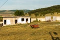 Farm equipment - firewood shed and red trolley Royalty Free Stock Photo