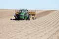 Farm equipment planting potatoes in an Idaho farm field. Royalty Free Stock Photo