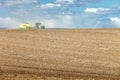 Farm equipment planting wheat in the fertile farm fields of Idaho. Royalty Free Stock Photo